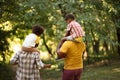 African American family walking trough park. Royalty Free Stock Photo