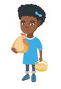 African girl holding a chicken and hen eggs.