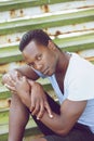 African american fashion model sitting on stairs outdoors Royalty Free Stock Photo