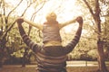 Young African American father carrying his daughter on shoulders Royalty Free Stock Photo