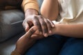 African father holding hands of child as charity support concept