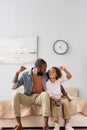 African american father and daughter showing