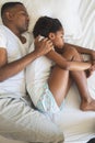 African American father and daughter sleeping together on bed in bedroom Royalty Free Stock Photo