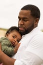 African American father holding his daughter. Royalty Free Stock Photo