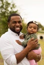 African American father holding his daughter. Royalty Free Stock Photo