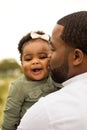 African American father holding his daughter. Royalty Free Stock Photo