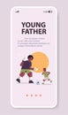 african american father playing football with son parenting fatherhood concept dad spending time with his kid Royalty Free Stock Photo