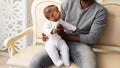 African American Father Playing With mixed race Baby Son Royalty Free Stock Photo