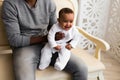 African American Father Playing With Mixed Race Baby Son At Home Royalty Free Stock Photo