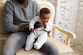 African American Father Playing With Mixed Race Baby Son At Home Royalty Free Stock Photo
