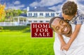 African American Father and Son In Front of Sale Sign and House Royalty Free Stock Photo