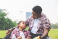 African american father and son having a picnic in the park, Happiness family concepts Royalty Free Stock Photo