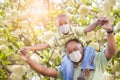 African American Father And Son Playing Outdoors Wearing Medical Face Mask