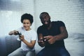 African American father with son plays video games Royalty Free Stock Photo