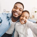 African-american father taking selfie with daughter at home Royalty Free Stock Photo