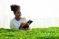 African American female biotechnologist using a tablet to check the quality of organic vegetables