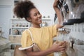 A customer fills cereal foods in a glass jar in a refill retail store