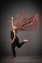 African American female dancing hip-hop with her hair in the air Royalty Free Stock Photo