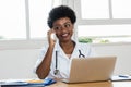 African american female doctor receiving emergency call Royalty Free Stock Photo