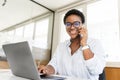 African-American female office employee using laptop Royalty Free Stock Photo