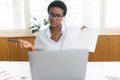 African-American female office employee using laptop Royalty Free Stock Photo