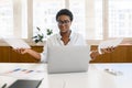 African-American female office employee using laptop Royalty Free Stock Photo