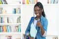 African american female student with braids showing thumb up Royalty Free Stock Photo