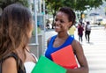 African american female student talking to caucasian girlfriend Royalty Free Stock Photo
