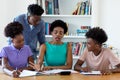 African american female tutor teaching students