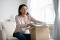 African American female volunteer put clothes in donation box Royalty Free Stock Photo