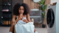 African American female woman girl pensive thinking ponder idea thoughtful think solution hesitate decide using mobile Royalty Free Stock Photo