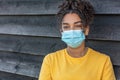 African American female young woman wearing face mask in Coronavirus COVID-19 pandemic Royalty Free Stock Photo