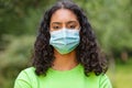 African American female young woman wearing face mask in Coronavirus COVID-19 pandemic Royalty Free Stock Photo