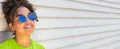 African American female young woman wearing sunglasses reflecting USA flag