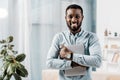 african american freelancer smiling with laptop