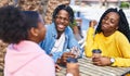African american friends having breakfast sitting on table at coffee shop terrace Royalty Free Stock Photo