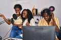 African american friends musicians group singing song at music studio