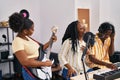 African american friends musicians group singing song at music studio