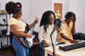 African american friends musicians group singing song at music studio