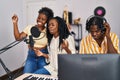 African american friends musicians group singing song at music studio