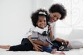 African american girl child enjoy playing telephone with her mother Royalty Free Stock Photo