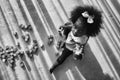 African american girl child playing letter block on floor in black and white