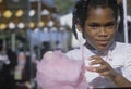 An African-American girl eating cotton candy, Natchez, MI