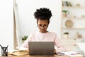 African American Girl At Laptop Learning Sitting At Home Royalty Free Stock Photo