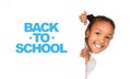 African-american girl peeking out from empty banner Royalty Free Stock Photo