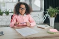 African american girl pretending to be businesswoman and doing paperwork in office Royalty Free Stock Photo