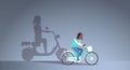 African american girl riding bike shadow of woman on motor scooter imagination aspiration concept female cartoon