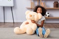 African american girl with soft bear