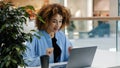 African american girl student business woman female user winner typing laptop surprised surprised yes gesture delight Royalty Free Stock Photo