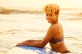 African american girl with surf board on beach going to the water Royalty Free Stock Photo